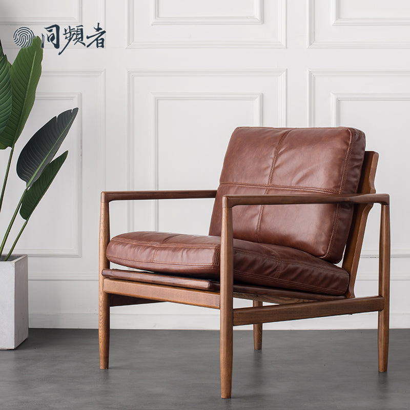 Brown leather armchair for commercial lounges